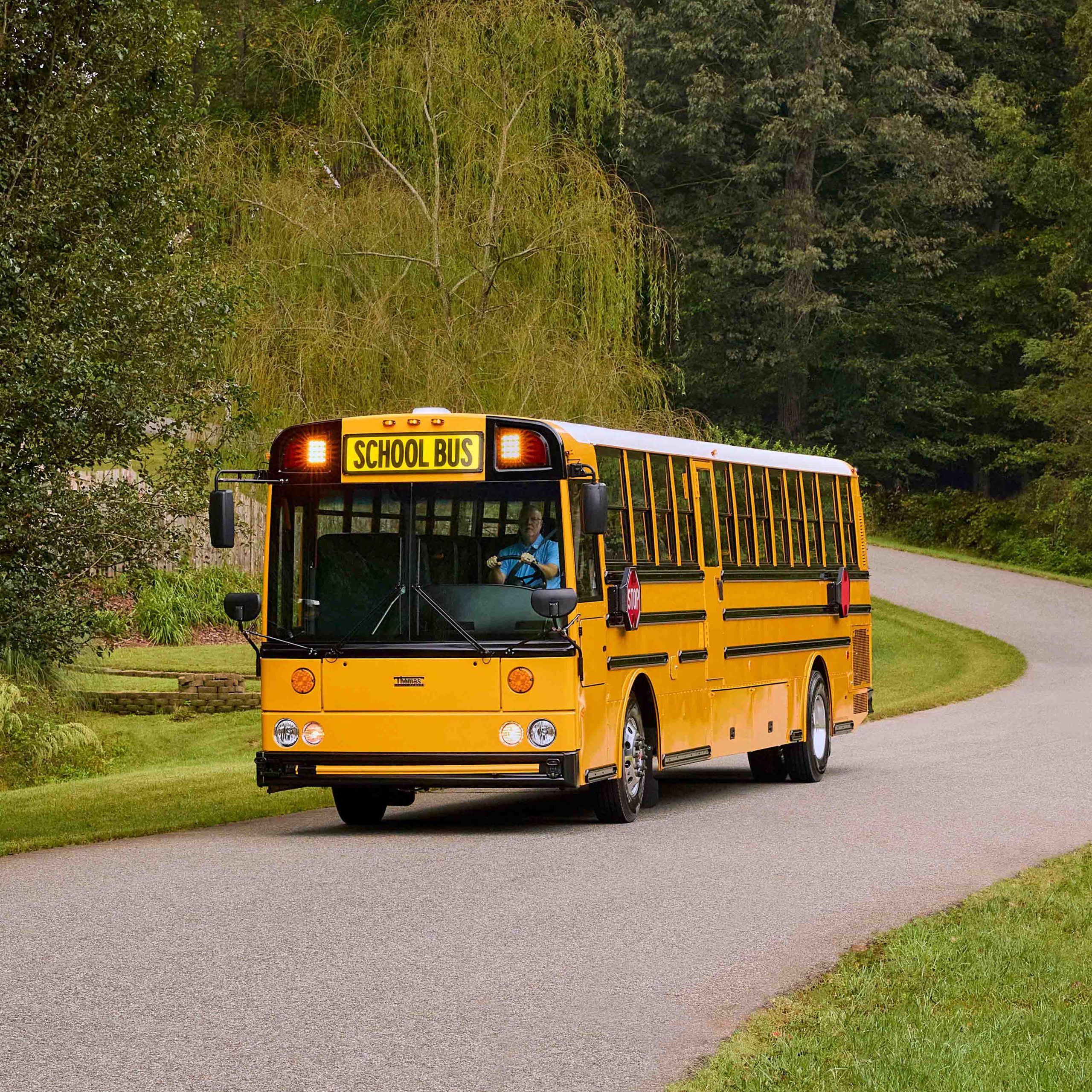 school bus driving on a road